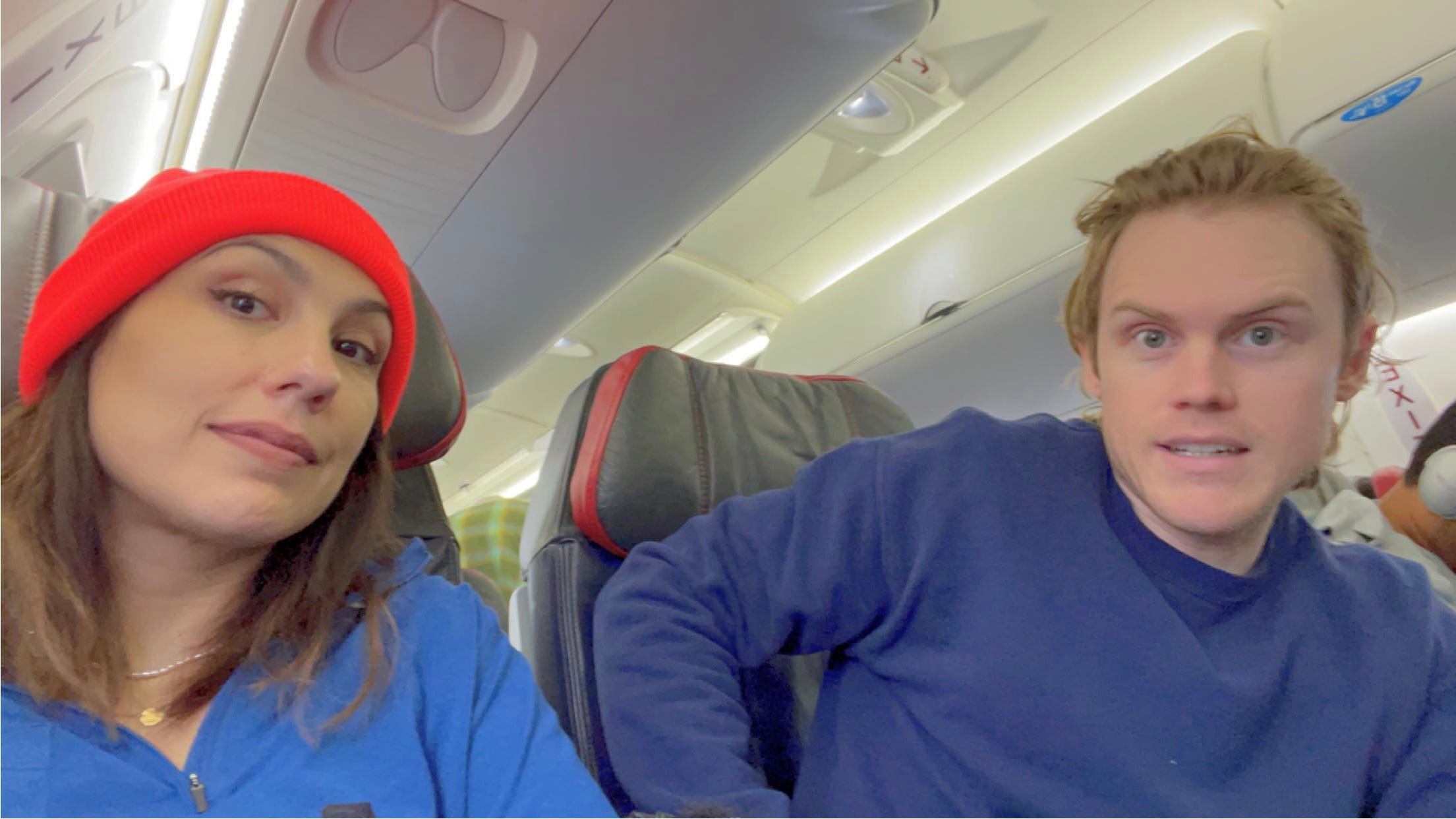 andrea valdez and brandon wells sitting in a plane