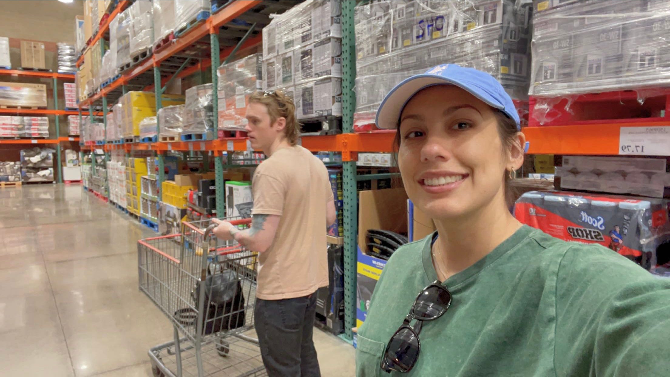 andrea valdez and brandon wells shopping in an aisle at costco