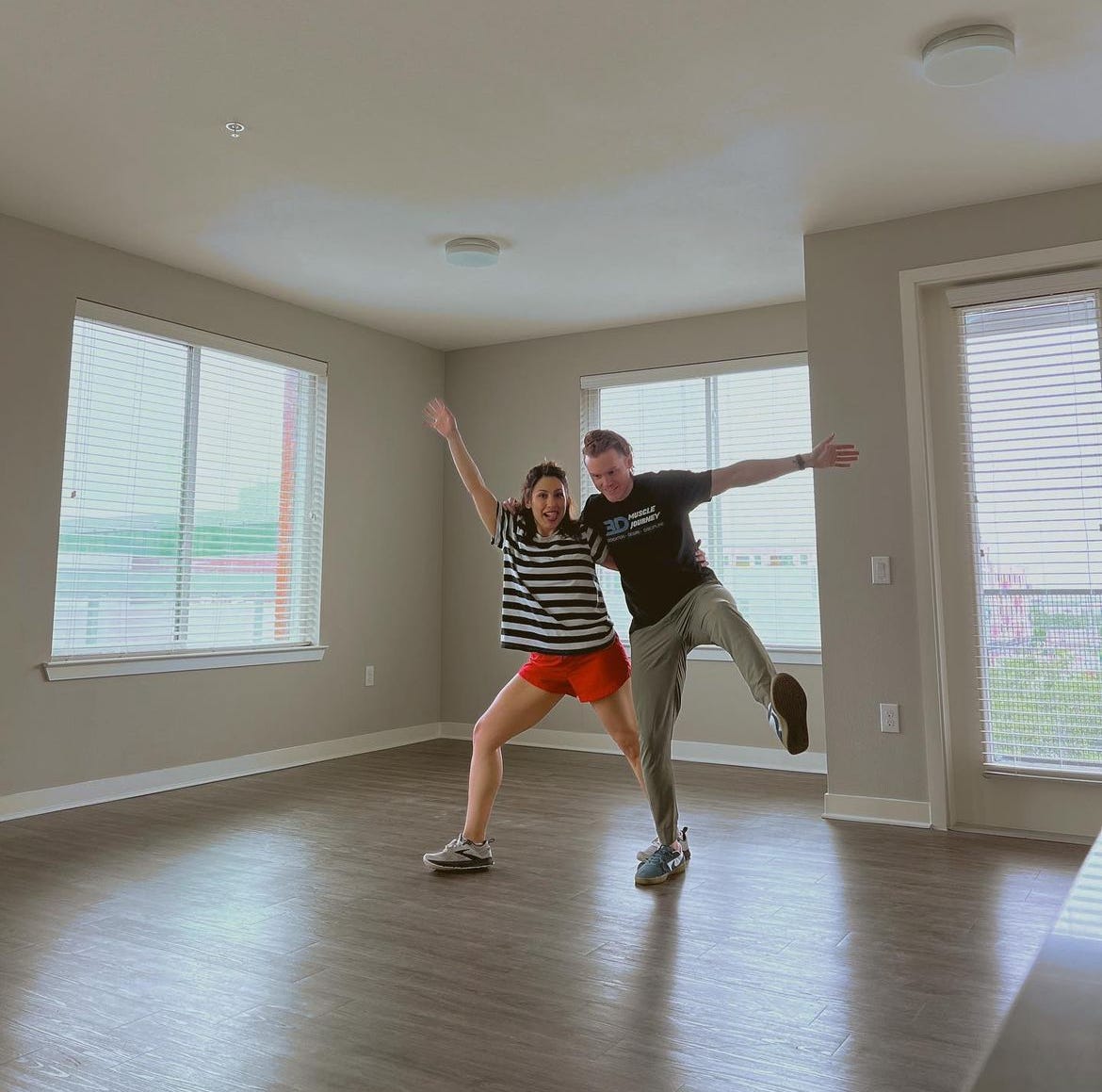 andrea valdez and brandon wells in an empty apartment