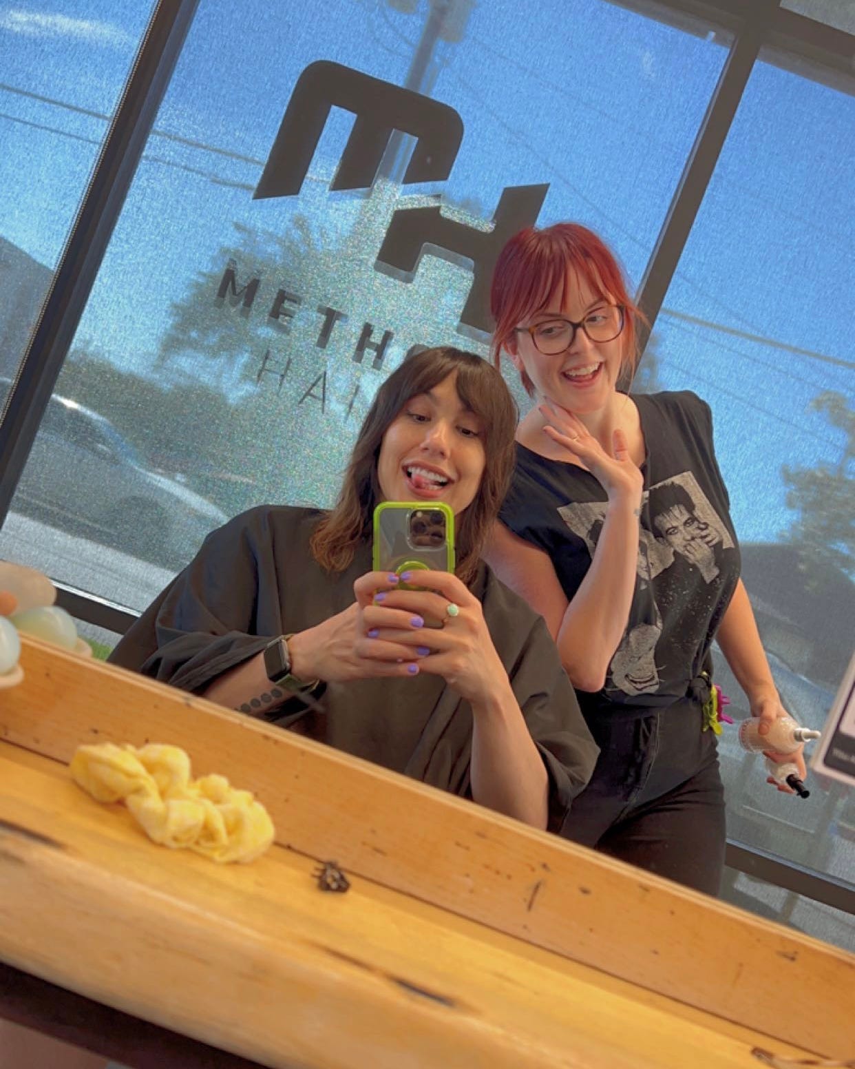 andrea valdez taking a mirror selfie with her lovely hair stylist, Clover